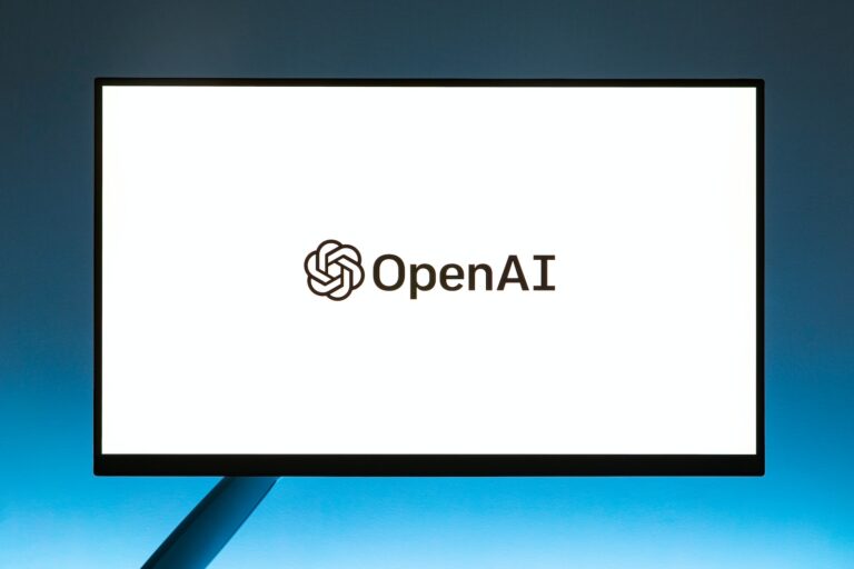 Monitor screen with OpenAI logo on white background